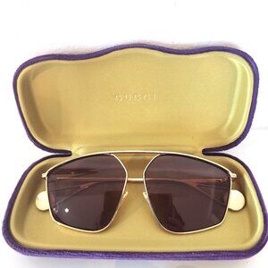 Gucci GG0437SA gold and burgundy tint womens sunglasses